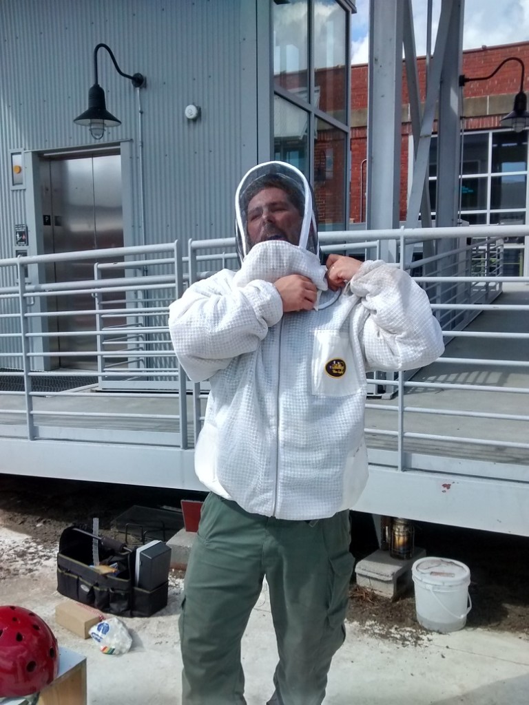 Suiting up, reqiured for last hive, whose trays were moved to another box.