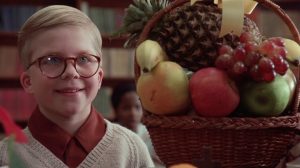 Ralphie staring hopefully at this teacher with his basket of fruit gift
